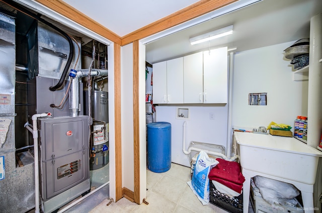 utility room with gas water heater and heating unit