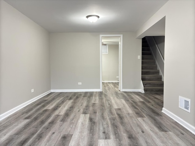 empty room with hardwood / wood-style flooring