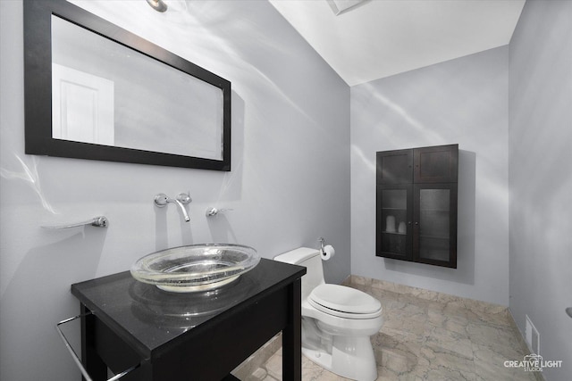 bathroom with vanity and toilet