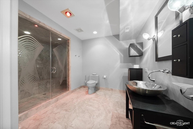 bathroom featuring vanity, toilet, and walk in shower