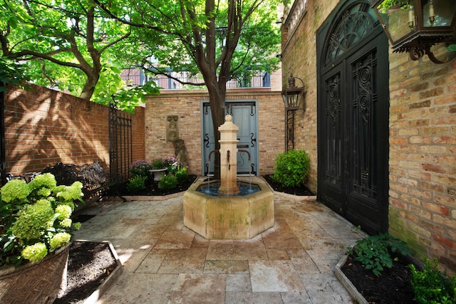 property entrance with a patio