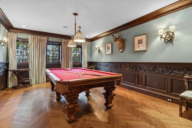 game room with light parquet flooring, ornamental molding, and billiards