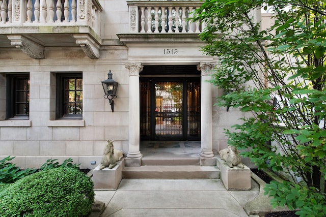 entrance to property with a balcony