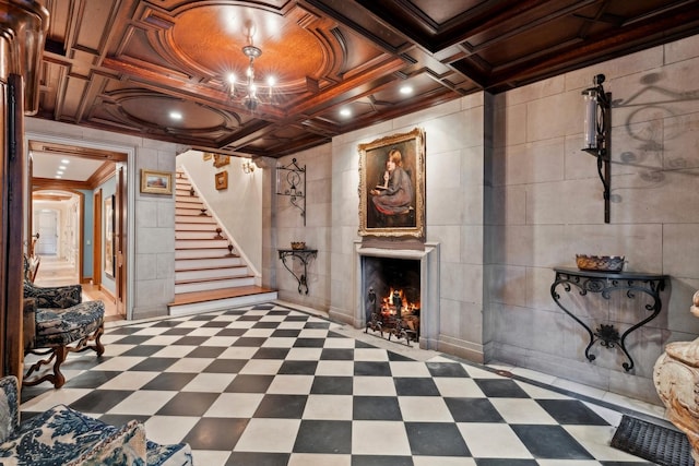 basement with ornamental molding and a fireplace