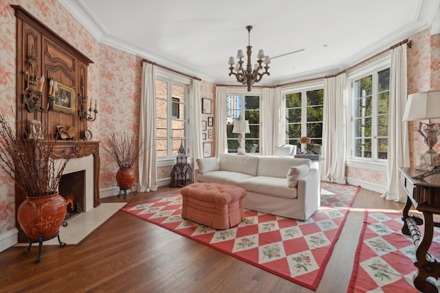 interior space featuring a chandelier, wood-type flooring, and ornamental molding