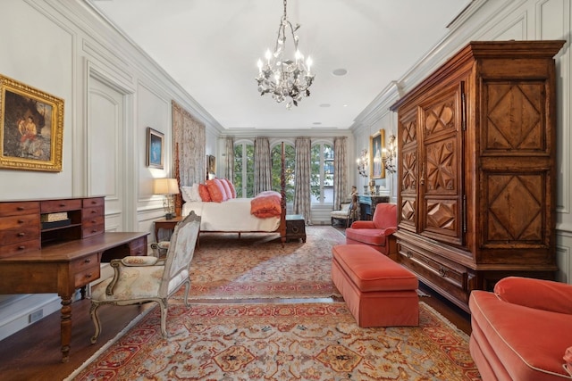 bedroom with crown molding and a chandelier