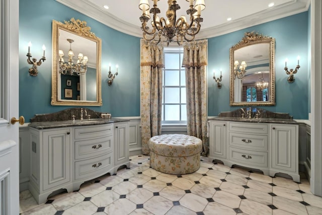 bathroom with crown molding and vanity