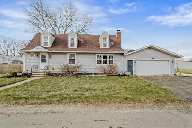 new england style home featuring a garage and a front yard