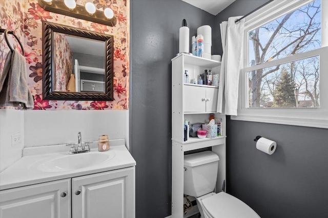 bathroom with vanity and toilet