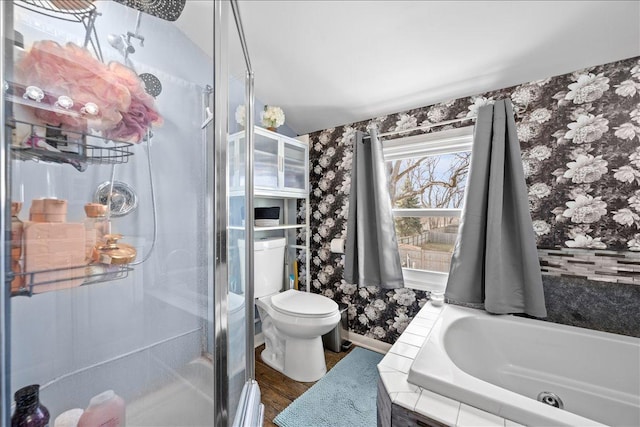 bathroom featuring hardwood / wood-style flooring, independent shower and bath, and toilet