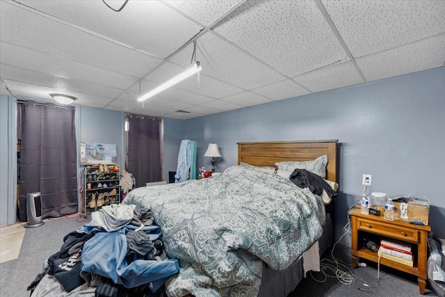 bedroom featuring a drop ceiling