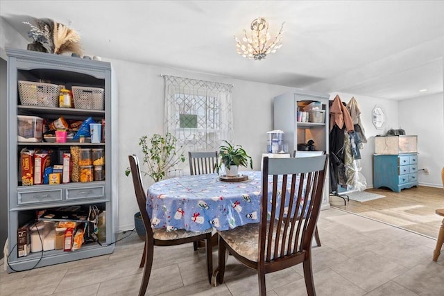 dining space with a chandelier