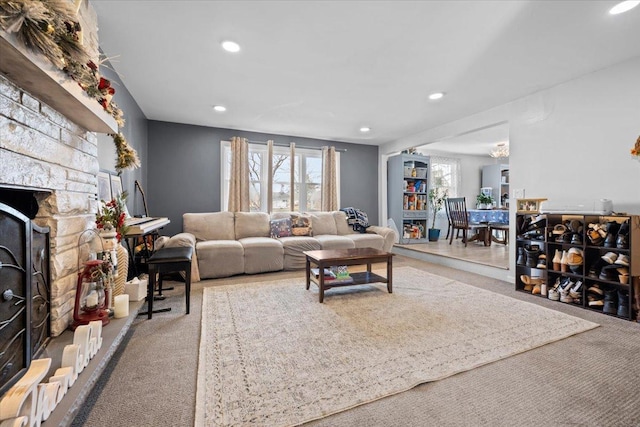 carpeted living room with a fireplace and a wealth of natural light