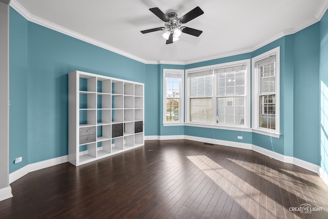 empty room featuring ceiling fan, wood-type flooring, and ornamental molding