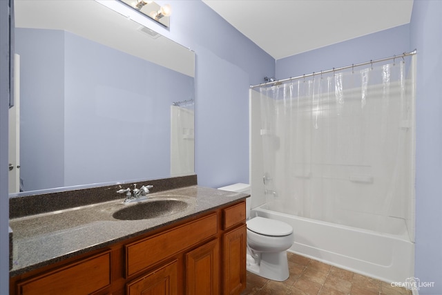 full bathroom with vanity, toilet, and shower / tub combo