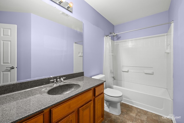 full bathroom featuring vanity, shower / bath combination, and toilet