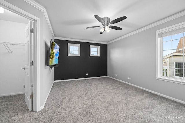 unfurnished bedroom featuring carpet floors, a closet, ceiling fan, and ornamental molding