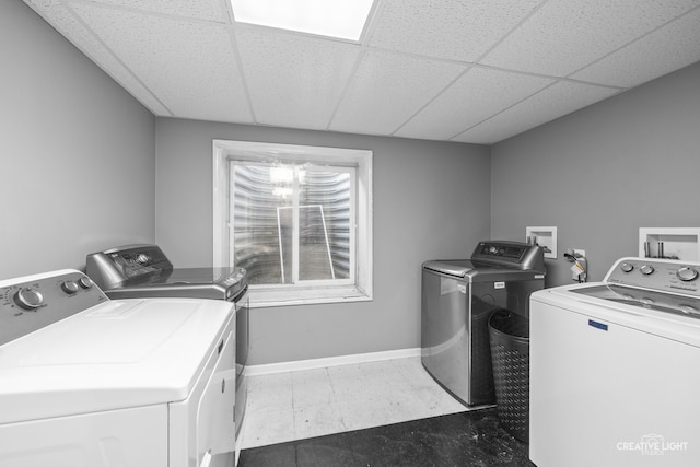 washroom featuring washer and clothes dryer