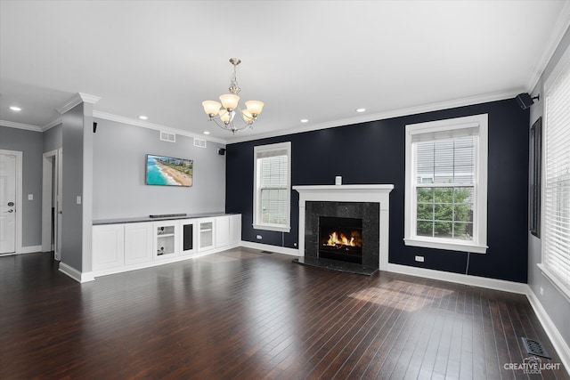 unfurnished living room featuring a fireplace, ornamental molding, a wealth of natural light, and dark wood-type flooring