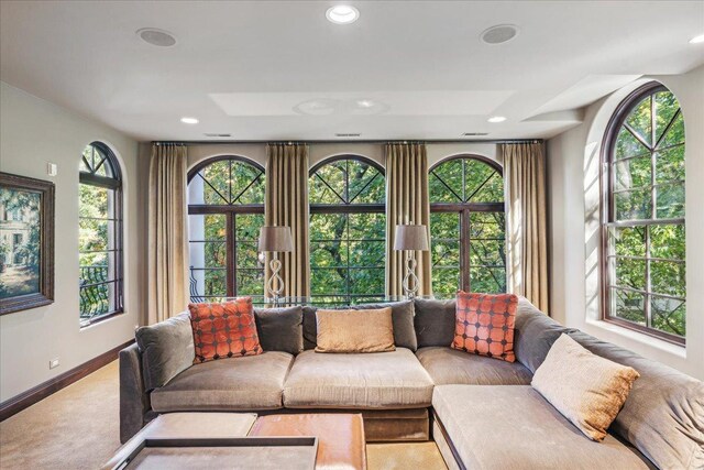 living area with recessed lighting, baseboards, and carpet