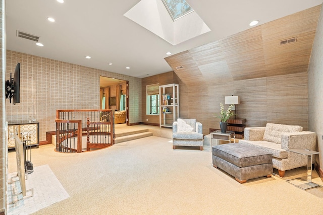 sitting room with carpet, a skylight, recessed lighting, and visible vents