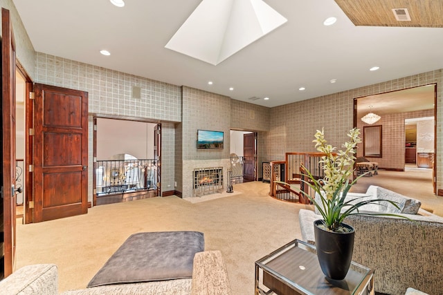 living room featuring visible vents, recessed lighting, wallpapered walls, and carpet flooring