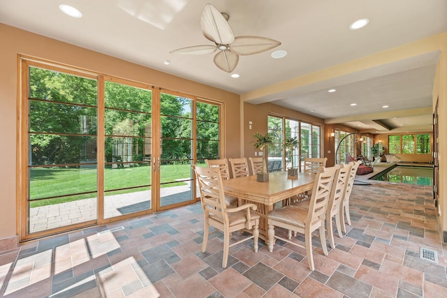 dining area featuring recessed lighting, visible vents, ceiling fan, and stone finish floor