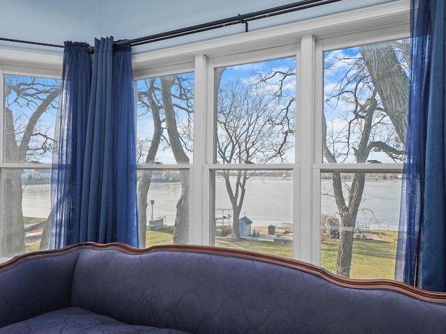 unfurnished bedroom featuring a water view