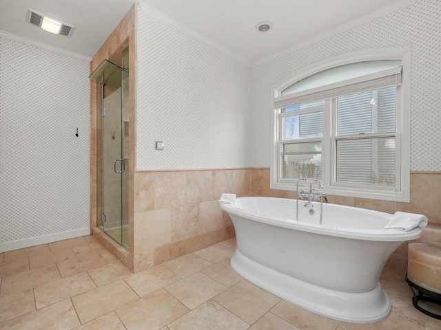 bathroom featuring tile patterned flooring, separate shower and tub, and ornamental molding