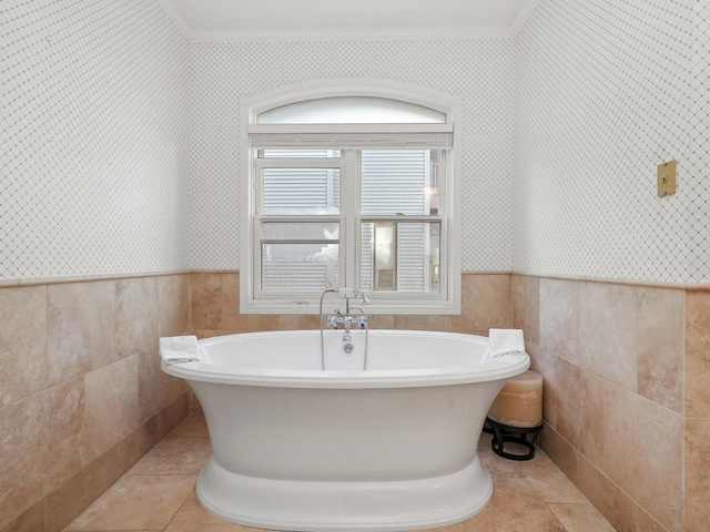 bathroom featuring a bathtub and crown molding