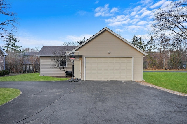 view of property exterior with a yard and a garage