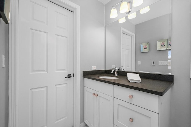 bathroom featuring vanity and an inviting chandelier