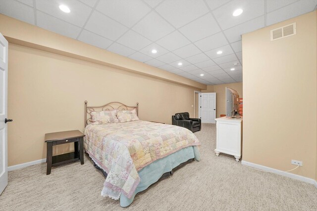 bedroom featuring light colored carpet