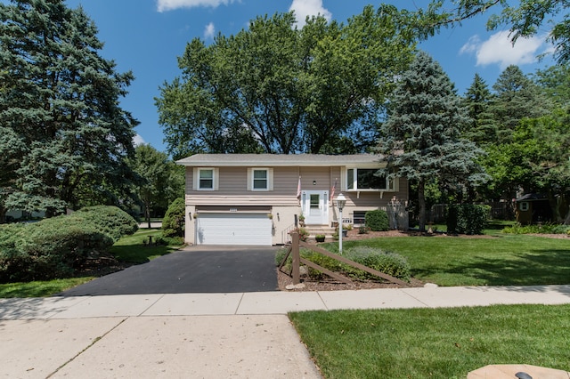 split foyer home with a front lawn and a garage