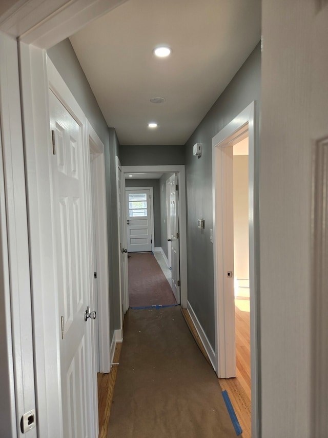 hall featuring dark wood-type flooring