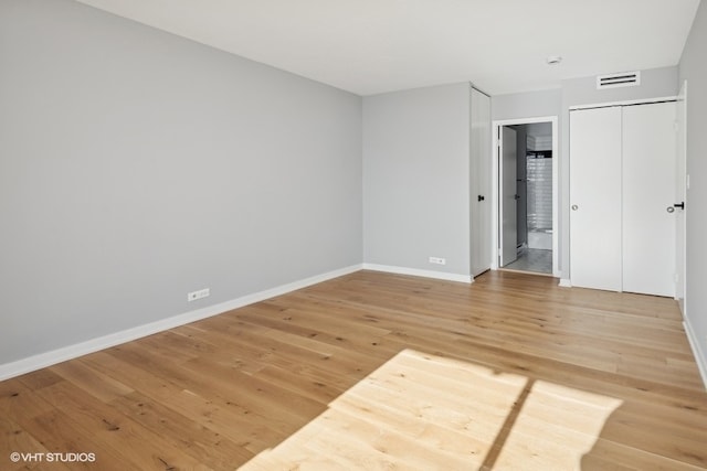 unfurnished room featuring wood-type flooring