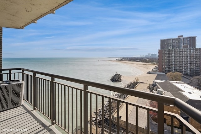 balcony featuring central AC and a water view