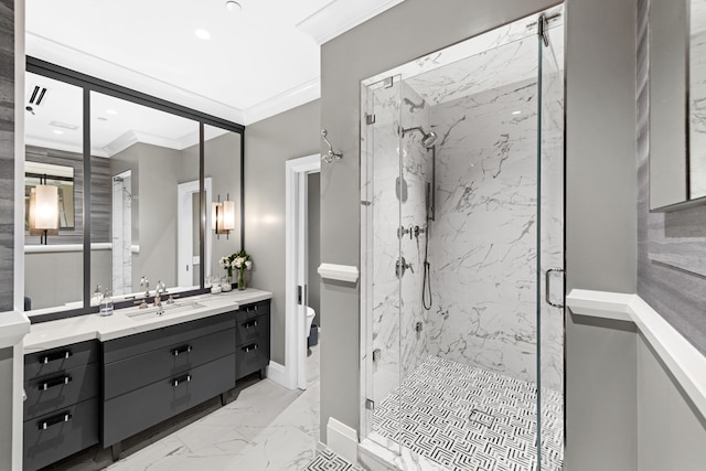 bathroom with vanity, toilet, a shower with door, and crown molding