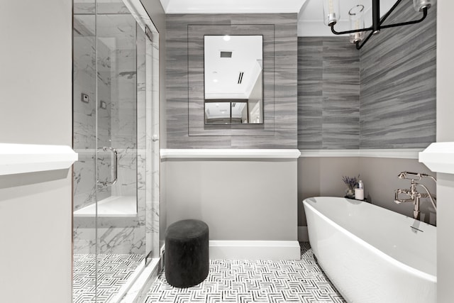 bathroom featuring tile patterned flooring and shower with separate bathtub