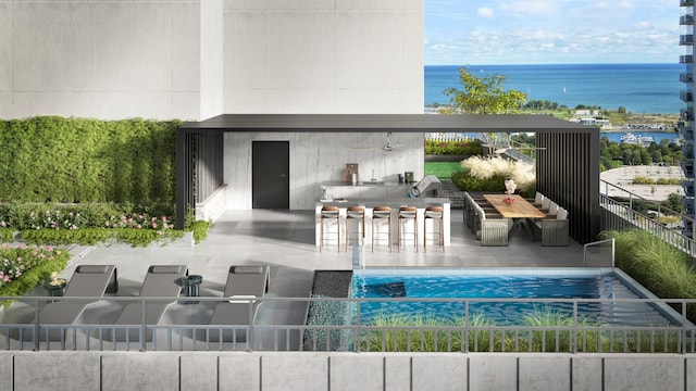 exterior space featuring a fenced in pool, a water view, exterior bar, and a patio