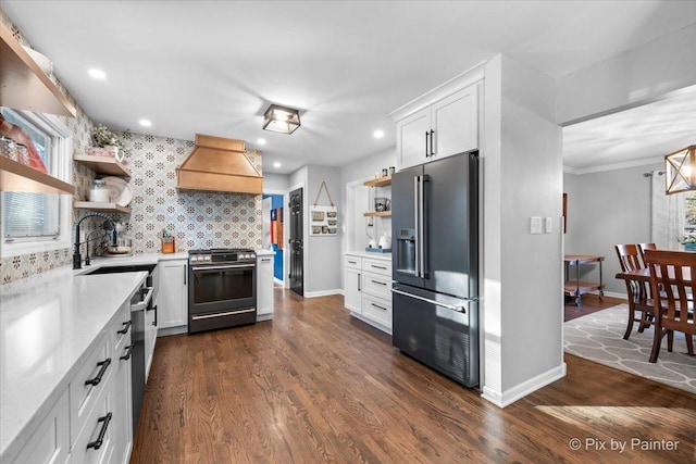 kitchen featuring white cabinets, custom exhaust hood, dark hardwood / wood-style flooring, and appliances with stainless steel finishes