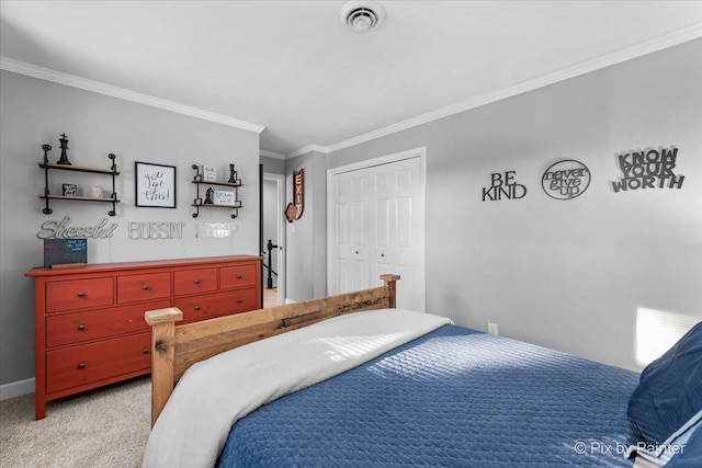 carpeted bedroom with crown molding and a closet