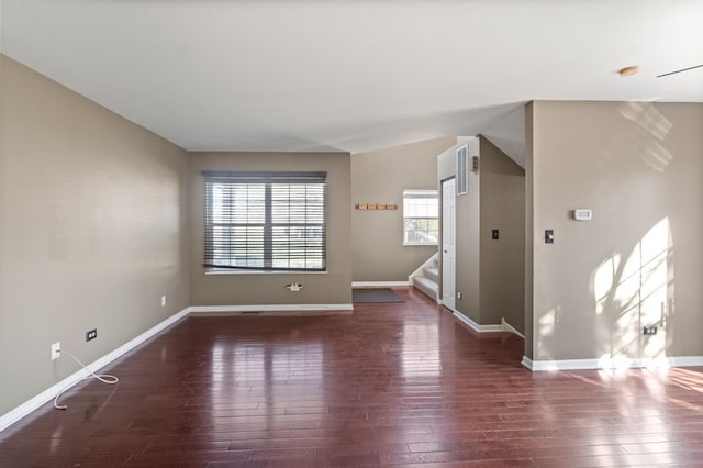 spare room with dark hardwood / wood-style flooring