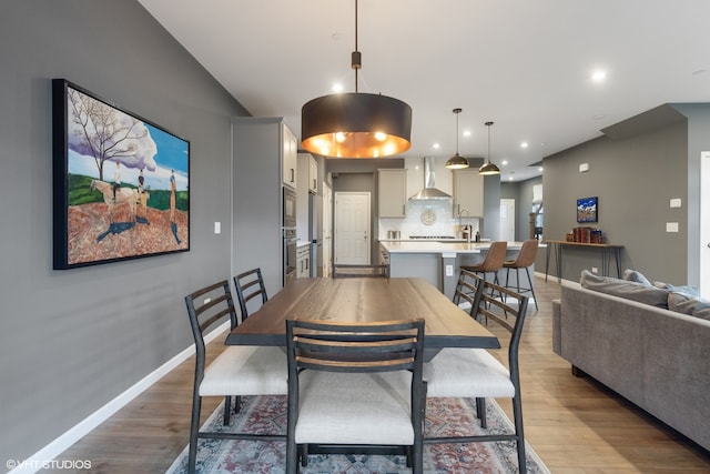 dining area with light hardwood / wood-style floors