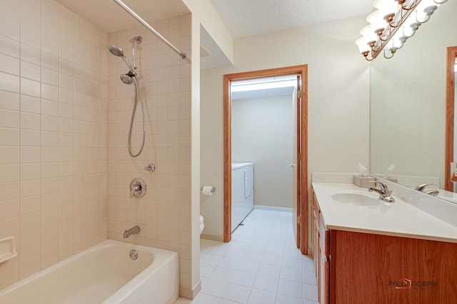 full bathroom featuring tiled shower / bath combo, tile patterned floors, a textured ceiling, toilet, and vanity