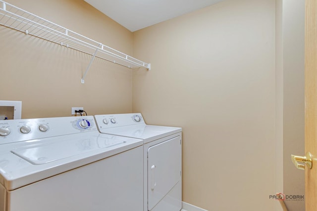 clothes washing area featuring washing machine and dryer