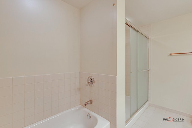 bathroom with tile patterned flooring and plus walk in shower