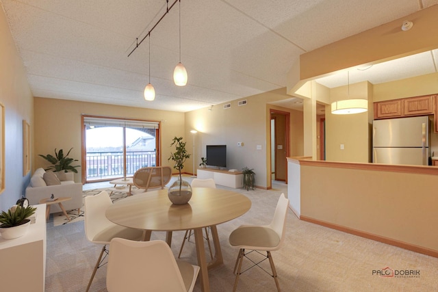 view of carpeted dining area