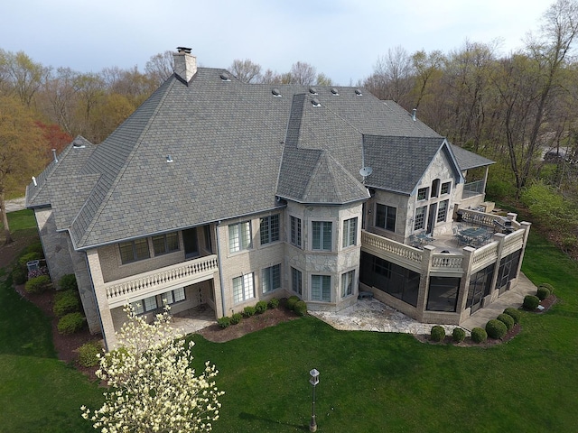 rear view of house with a lawn