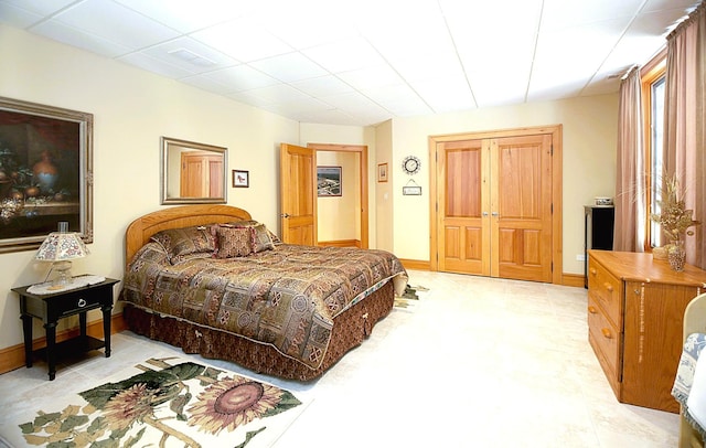 bedroom with a paneled ceiling